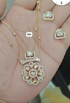 Kundan pendant necklace set featuring a delicate chain and floral design