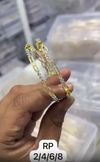 Gold-plated bangles With an infinity design.