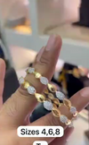 Gold-plated bangles with leaf-shaped designs
