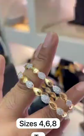 Gold-plated bangles with leaf-shaped designs