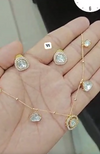 Gold-plated necklace and matching earring set adorned with moissanite stones