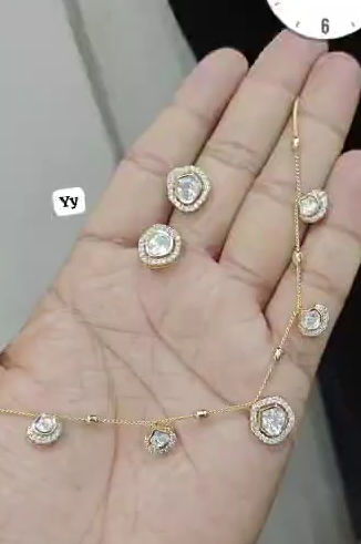 Gold-plated Polki or Kundan designer necklace set featuring drop-shaped pendants