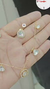 Gold-plated necklace and matching earring set adorned with moissanite stones