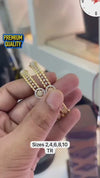 Gold-plated bangles feature an intricate filigree design