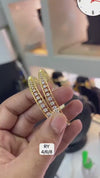 Pair of gold-plated bangles with CZ diamonds in a baguette design