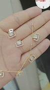 Kundan pendant necklace set featuring a delicate chain and floral design